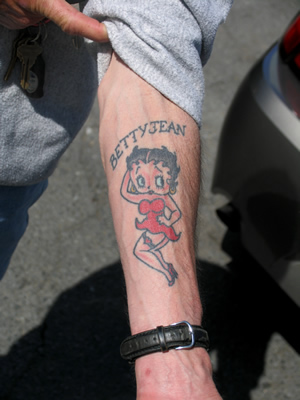 He had the Slang – Attitude and a Betty Boop Tattooed on his forearm